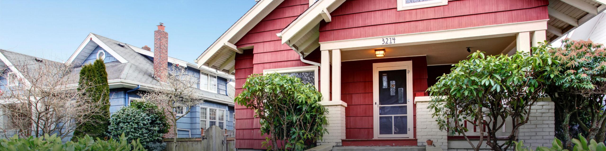Classic craftsman old American house exterior in red and white.