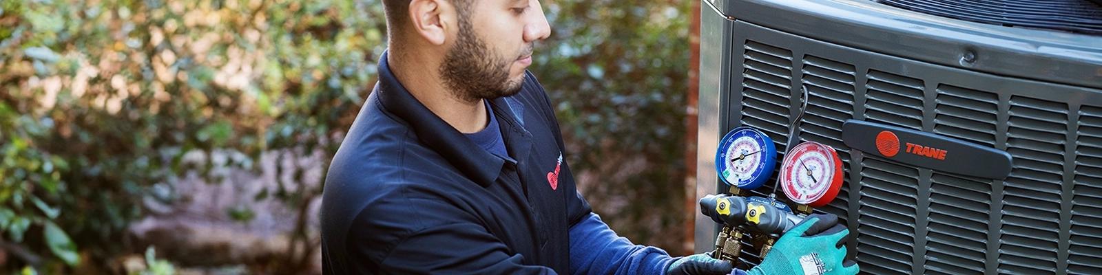 HVAC Technician with Refrigerant Gauge