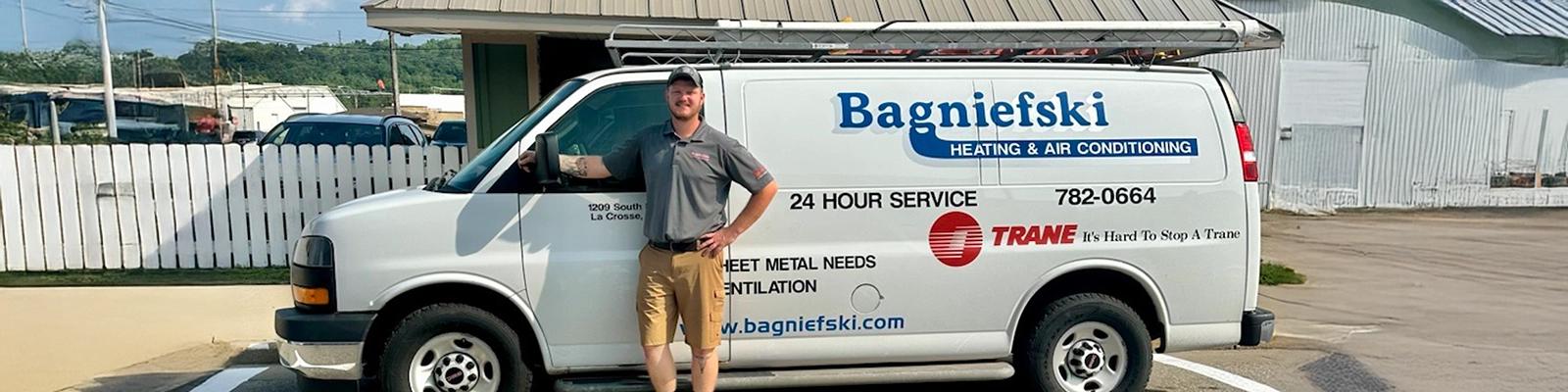 Kolton Flick in front of a Bagniefski HVAC Service Van