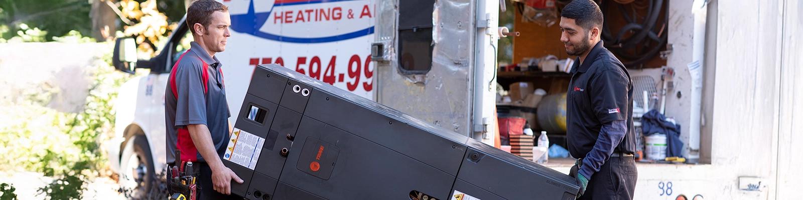HVAC Installation Near Me - Two HVAC Technicians Delivering an HVAC Unit