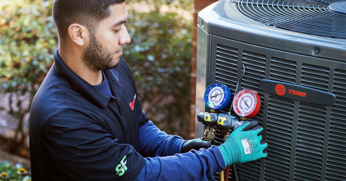 HVAC Technician with Trane R-454B-Compliant HVAC Unit